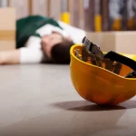 Worker fallen over with Hard hat