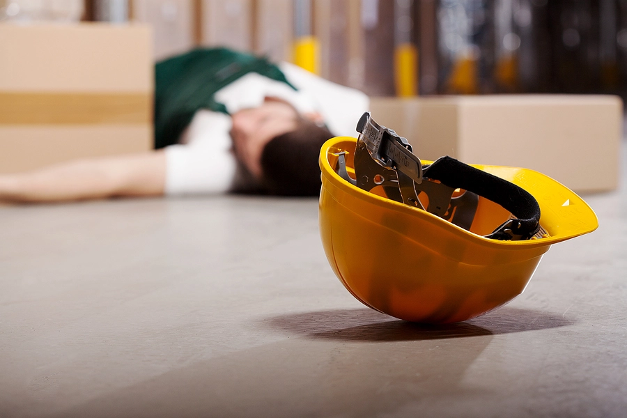 Worker fallen over with Hard hat